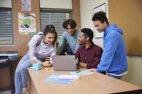 students and counselor in school